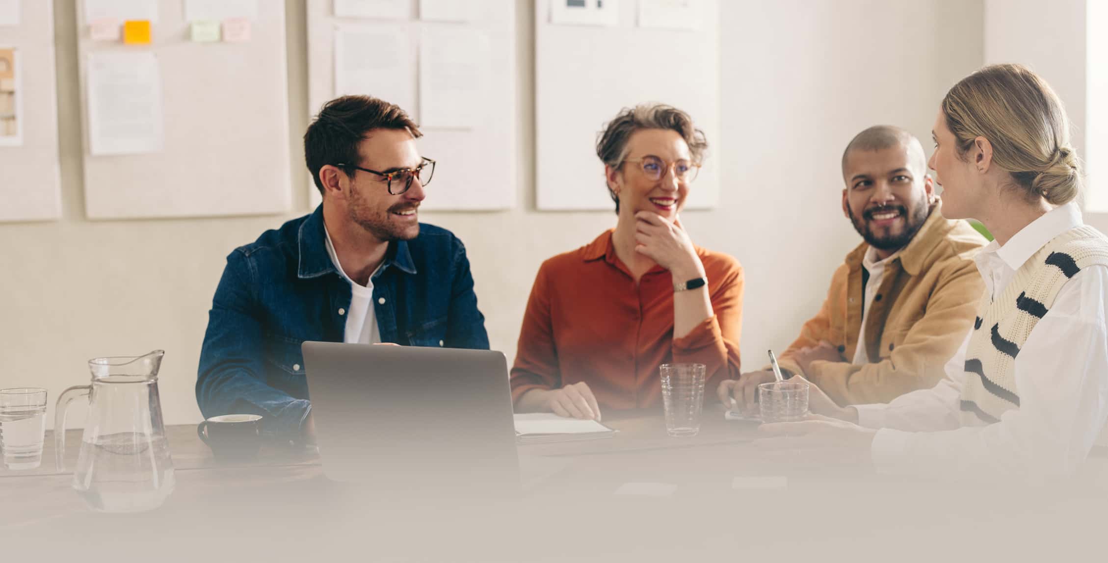 Colleagues sharing ideas while working together